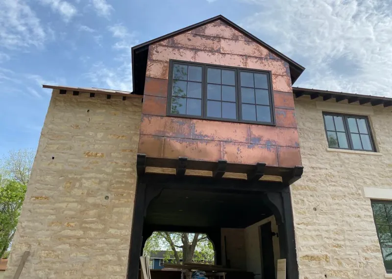 Copper metal panel facade on a stone building for Roof Repair in Kiryas Joel